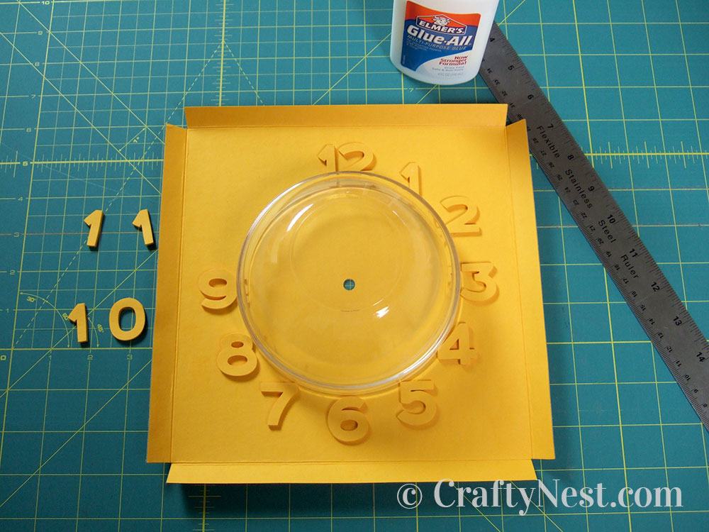 howto10-embossed-numbers-clock-crafty-nest Using a bowl to place the numbers, photo