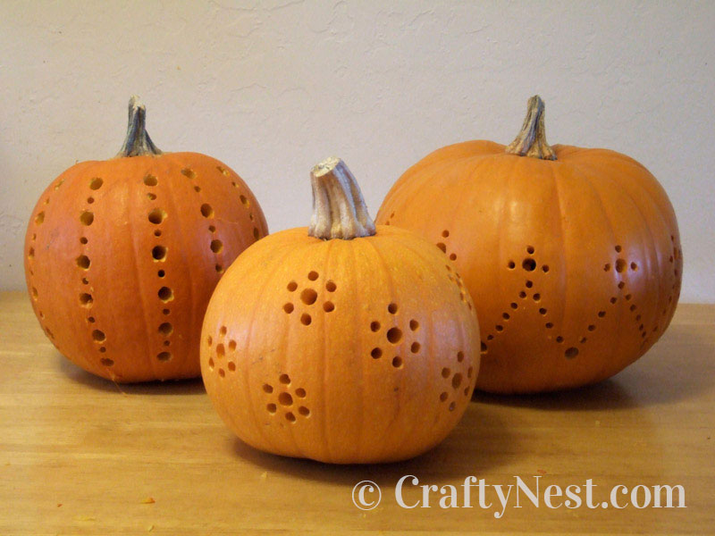 all-drilled-small-diy-pumpkins-carved-with-a-drill-crafty-nest All three pumpkins drilled, photo