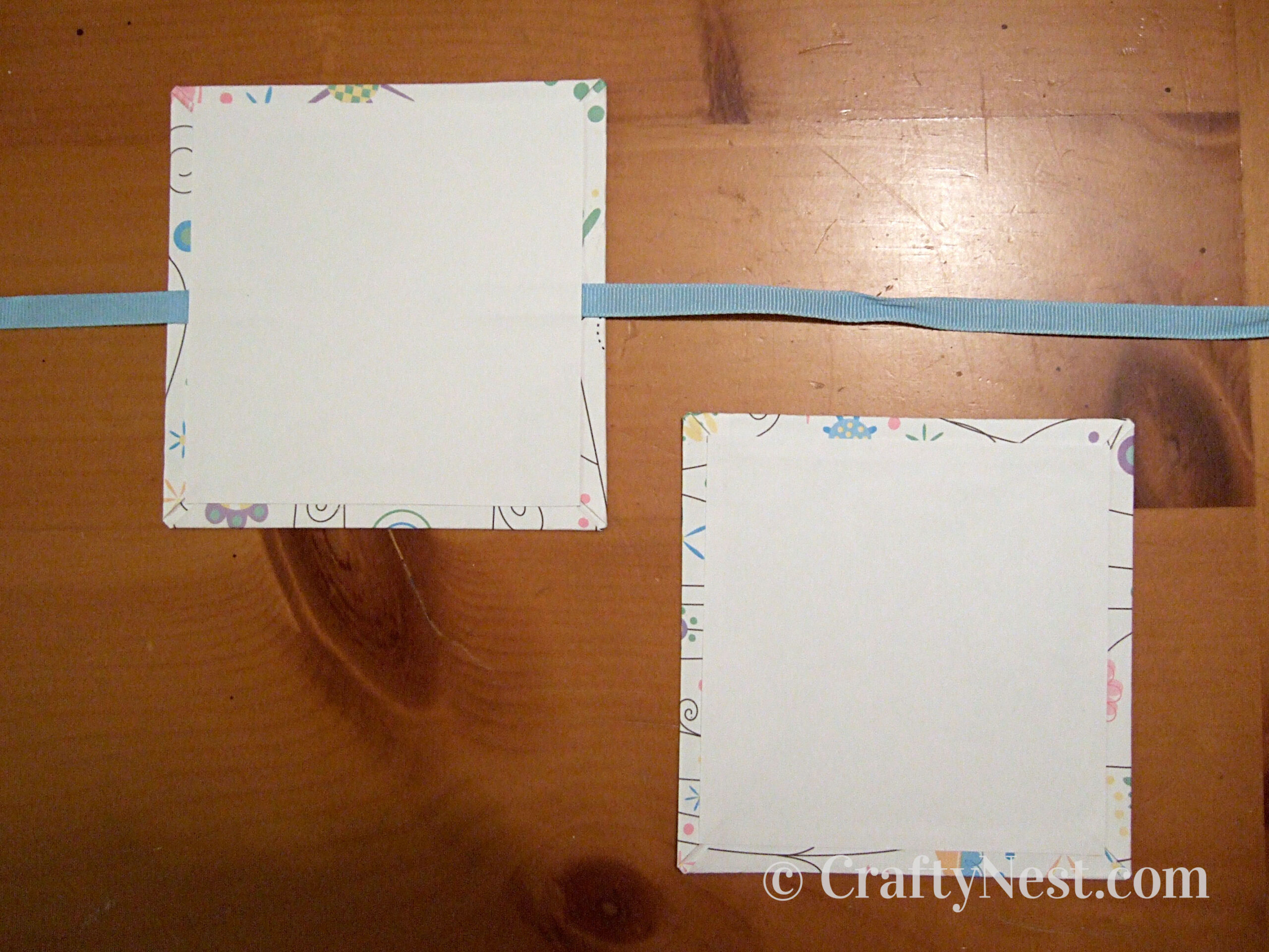 covering-accordion-books-crafty-nest Glue ribbon onto book cover, photo
