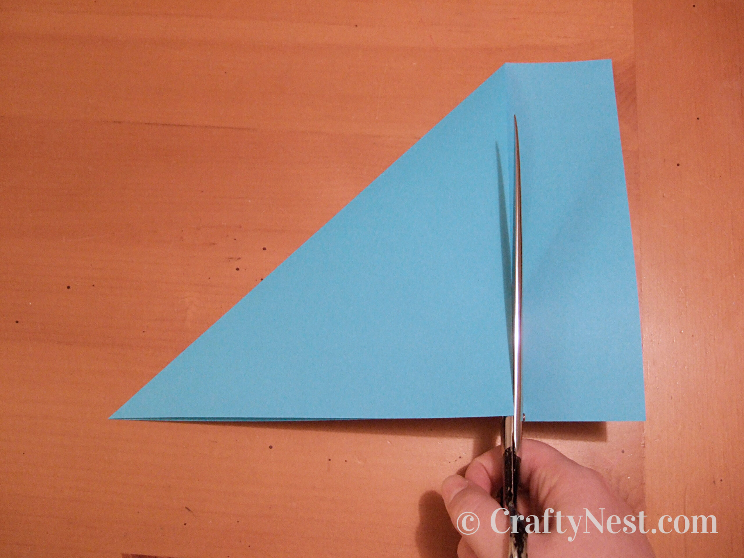 cutting-pages-accordion-books-crafty-nest Cutting paper into a square, photo