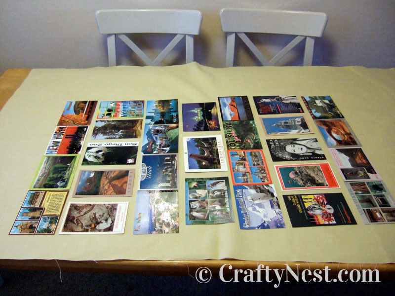postcard-layout-diy-postcard-collage-crafty-nest Postcards laid out on the fabric, photo