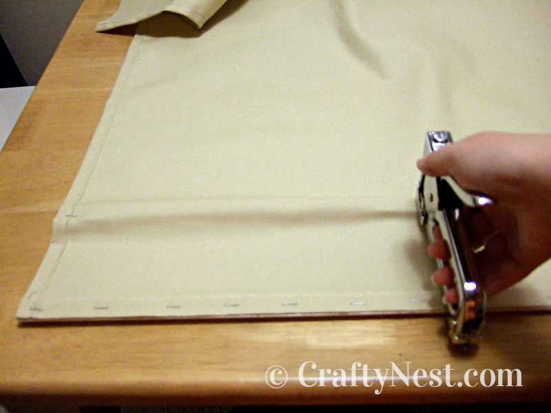 staple-2nd-row-diy-postcard-collage-crafty-nest Stapling the second piece of trim, photo
