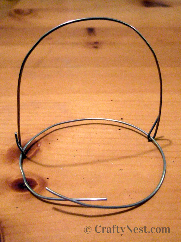 wire-wrapping-diy-hanging-jar-lanterns-crafty-nest Looping the handle onto another piece of wire, photo