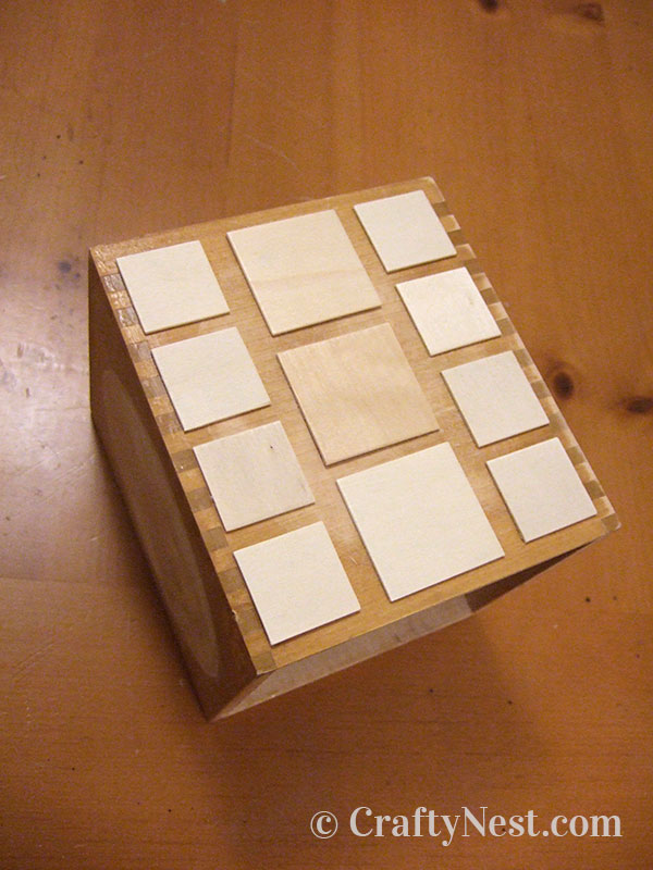 woodsies-glued-diy-tissue-box-cover-crafty-nest Wood squares placed on the box, photo