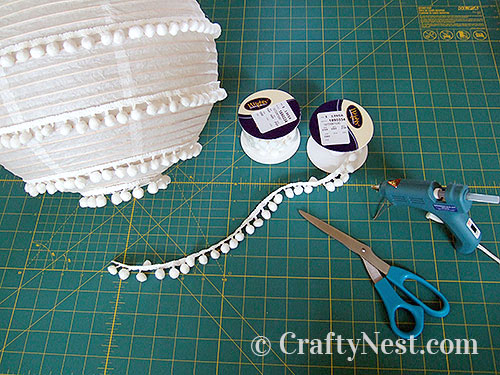 DSCF5254-two-paper-lanterns-flowers-pom-poms-crafty-nest Glue on the pom-pom fringe, photo
