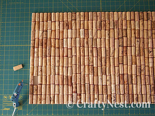 almost-done-wine-cork-bath-mat-crafty-nest Glue the rest of the wine corks, photo