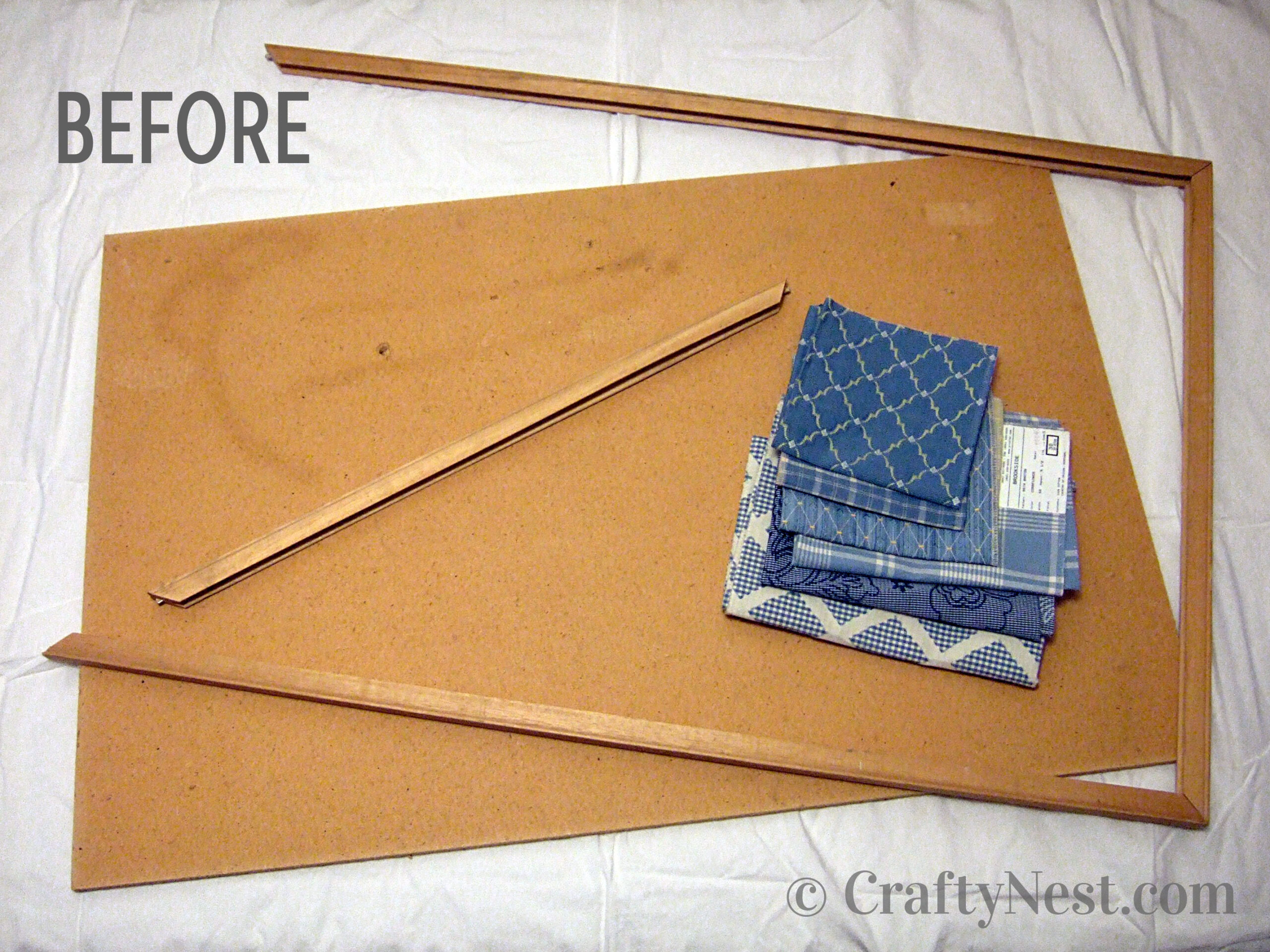 before-salvaged-patchwork-bulletin-board-crafty-nest Broken bulletin board and fabric, photo
