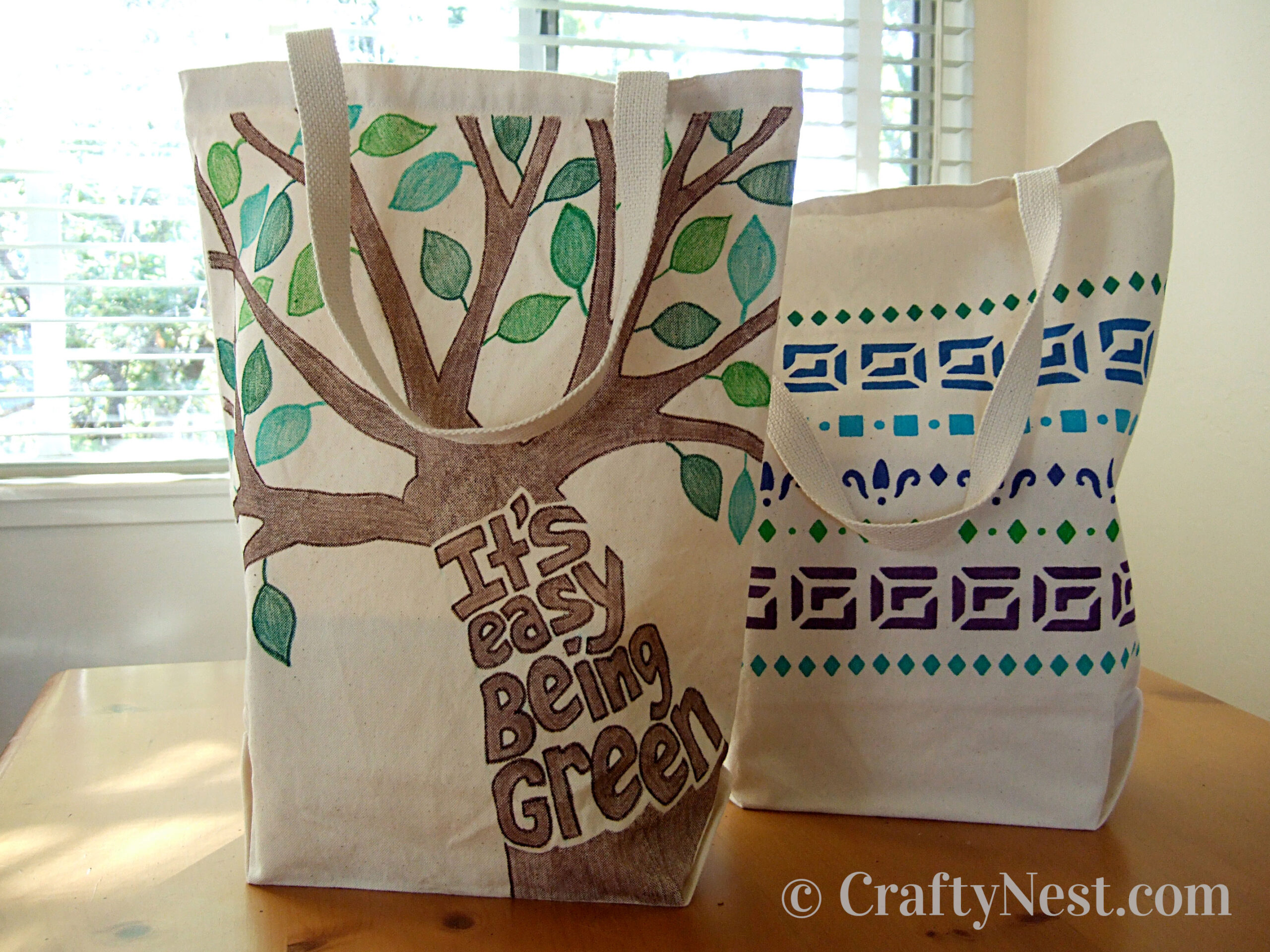 hero-decorated-canvas-totes-crafty-nest Two canvas tote bags with paint marker designs, photo