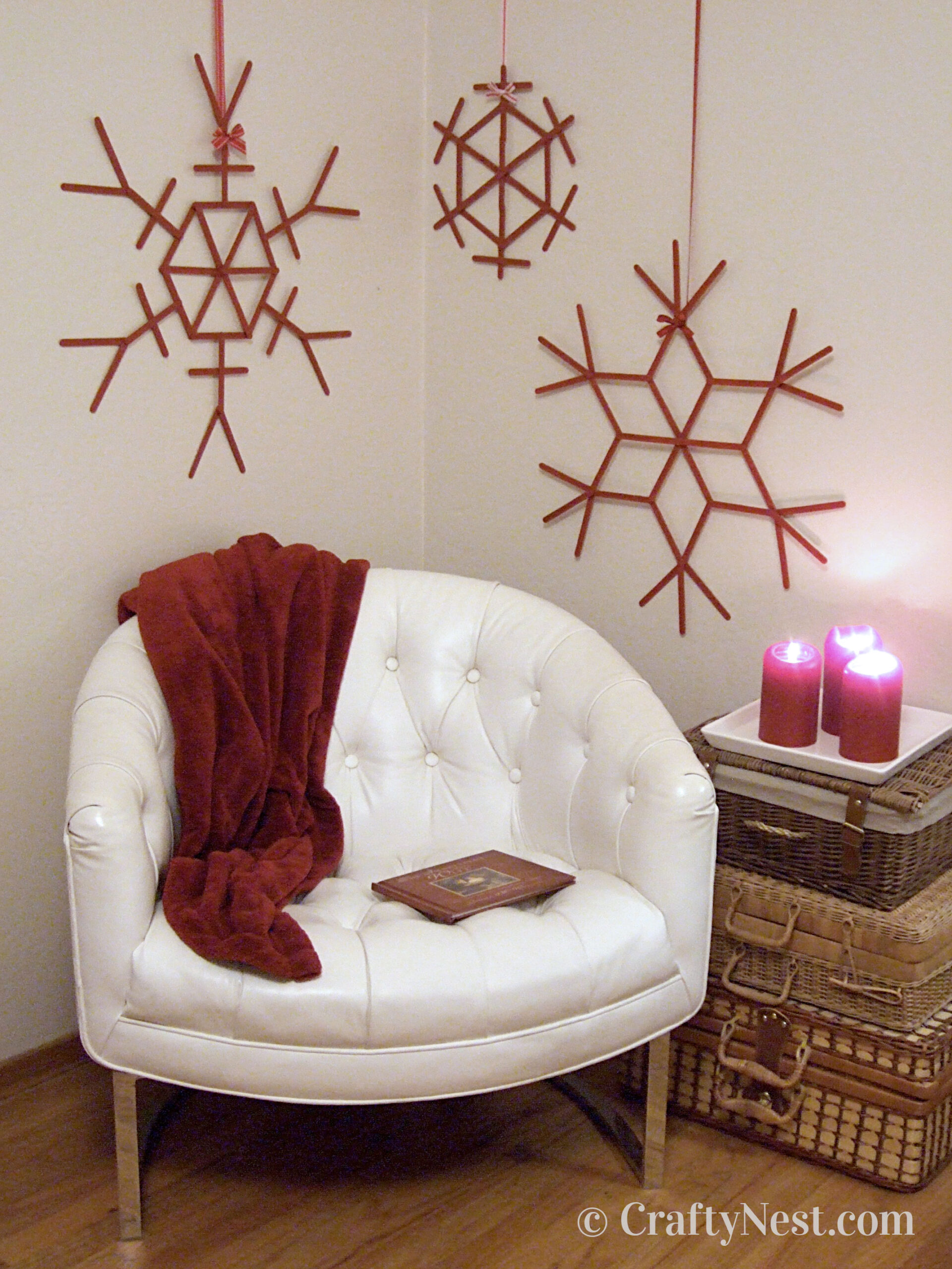 hero1-giant-craft-stick-snowflakes-crafty-nest Red craft-stick snowflakes on wall, photo