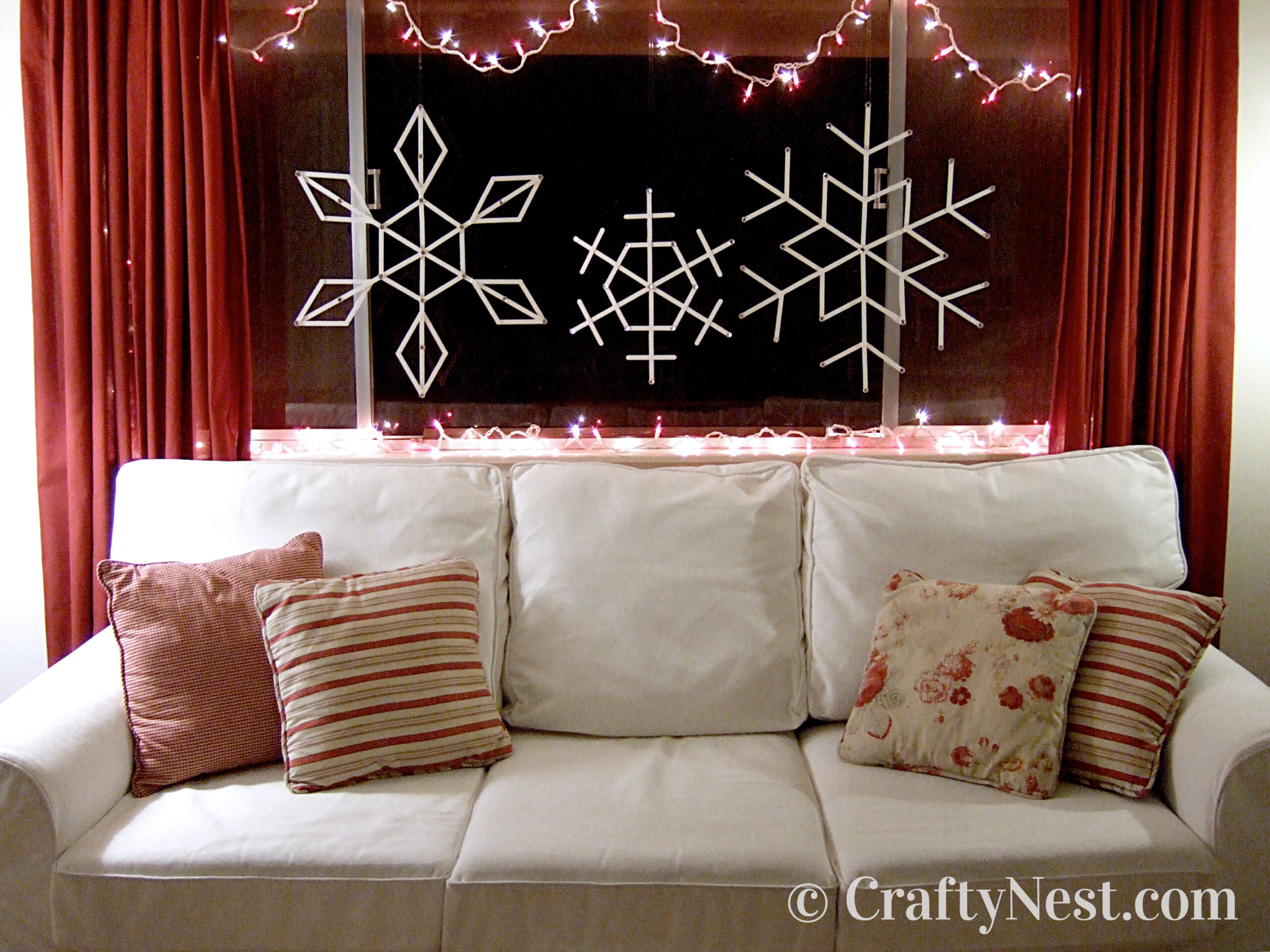 hero2-giant-craft-stick-snowflakes-crafty-nest White craft-stick snowflakes in window, photo