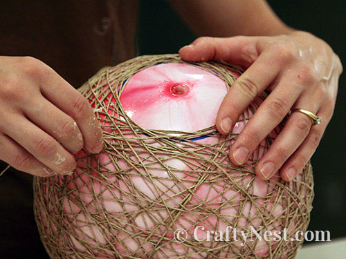 holding-hemp-pendant-lamps-crafty-nest Wrapping the string around the ball, photo