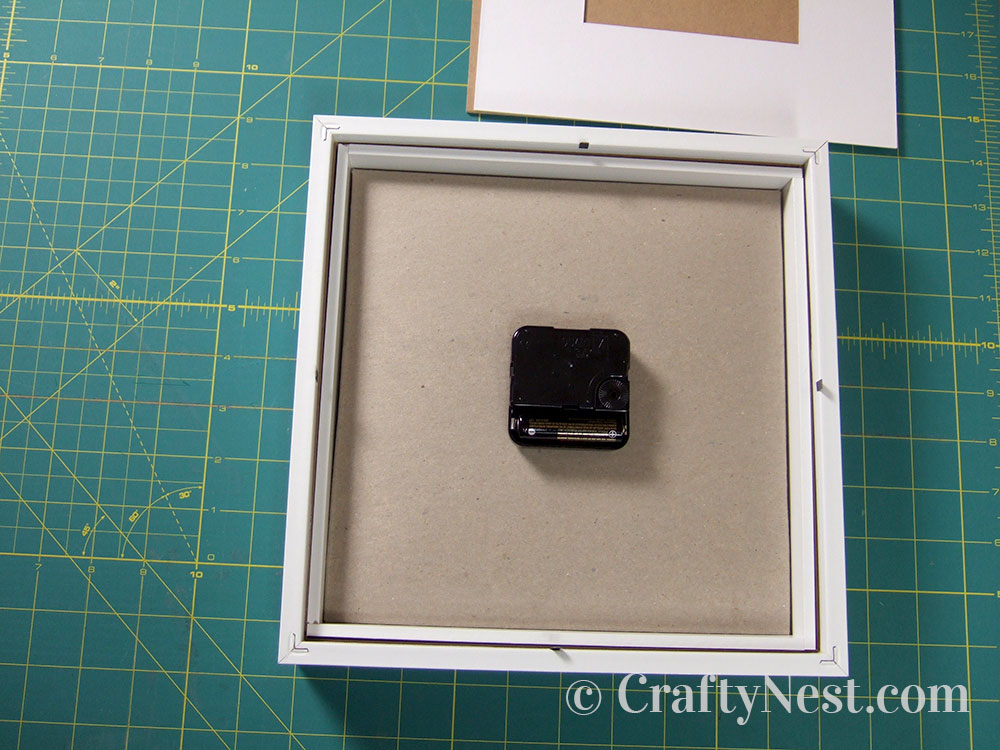 howto14-embossed-numbers-clock-crafty-nest Insert the clock mechanism, photo