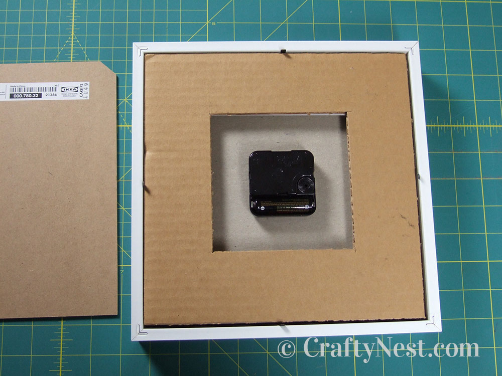 howto16-embossed-numbers-clock-crafty-nest Insert the cardboard and clock face, photo