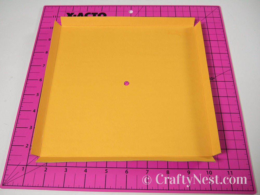 howto5-embossed-numbers-clock-crafty-nest Fold the edges of the clock face, photo