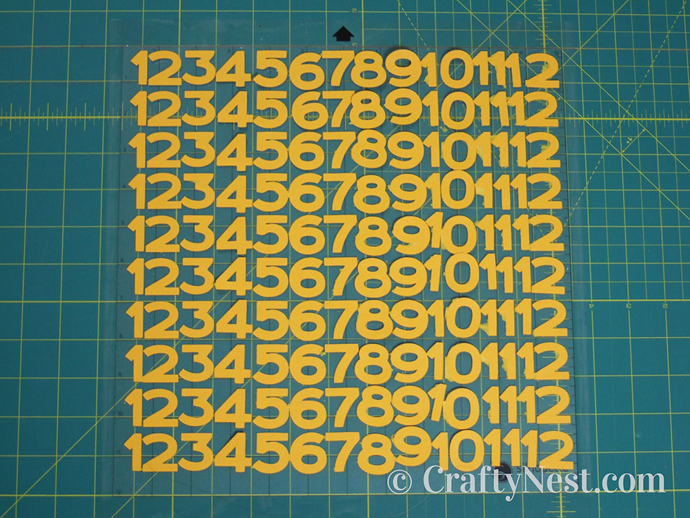 howto6b-embossed-numbers-clock-crafty-nest The clock numbers cut out, photo