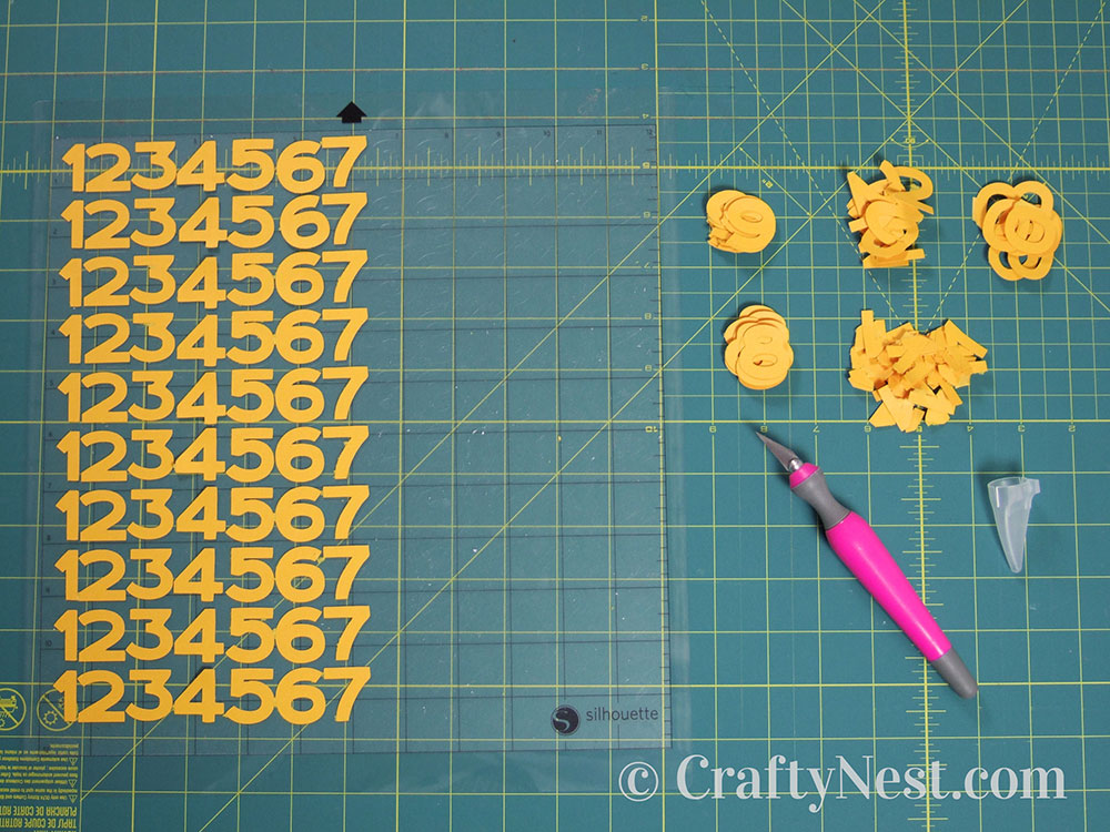 howto7-embossed-numbers-clock-crafty-nest Peeling off the numbers, photo