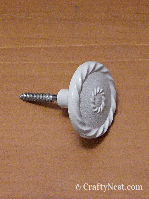 knob-bolt-ugly-plastic-mirror-cork-board-crafty-nest Insert hanger bolt in drawer pull, photo