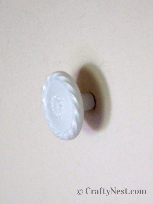 knob-in-wall-ugly-plastic-mirror-cork-board-crafty-nest Screw hanger bolt into wall, photo
