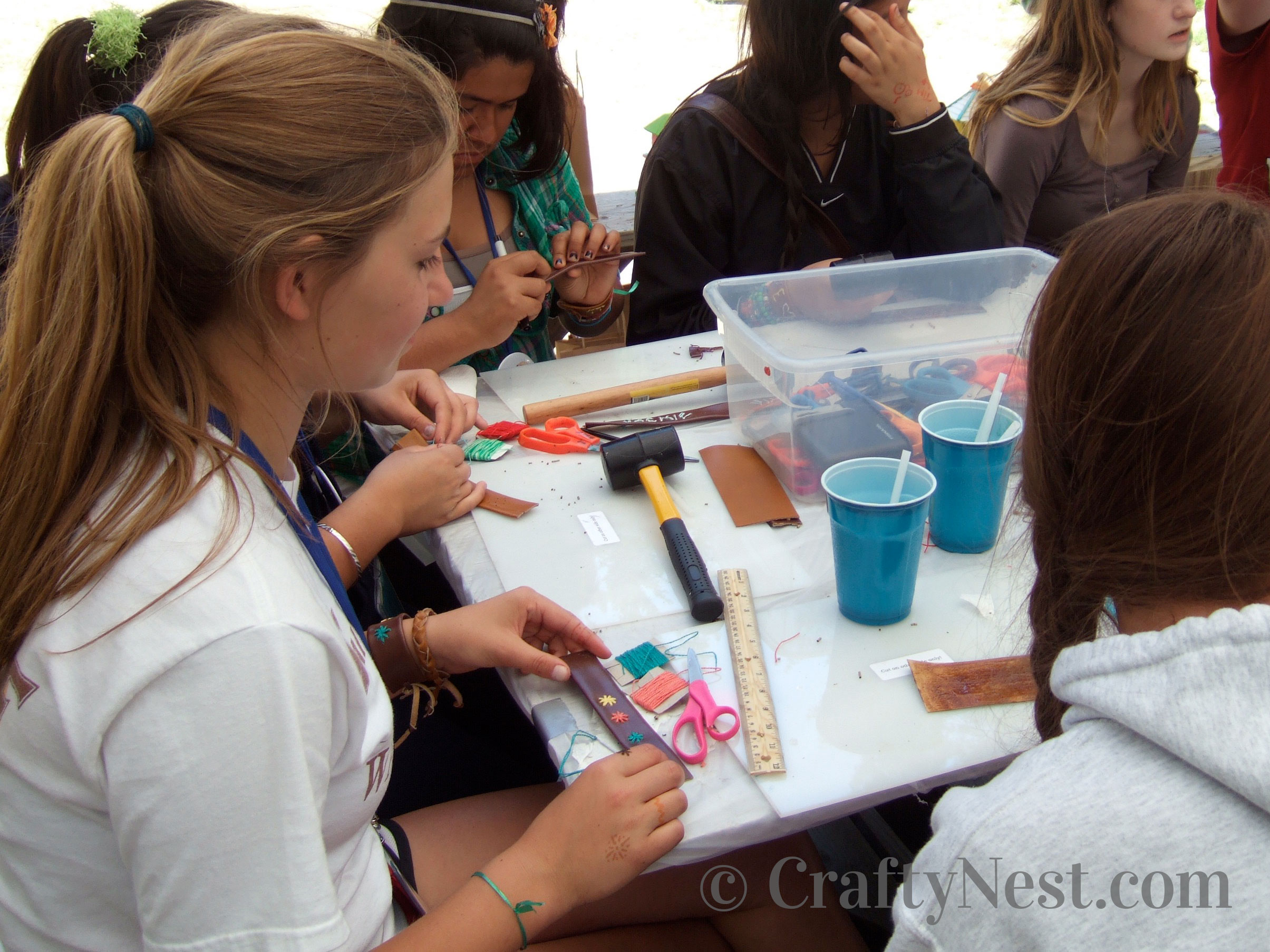 DSCF7423-stitched-leather-bracelets-crafty-nest Girls making bracelets at camp, photo