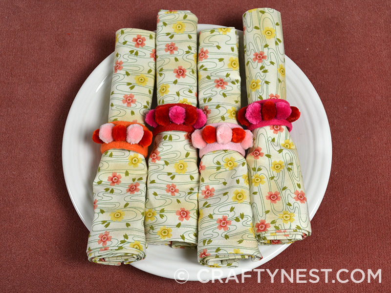 DSC_0002-carpet-sample-craft-easter-placemats-crafty-nest Pom pom napkin rings on napkins, photo