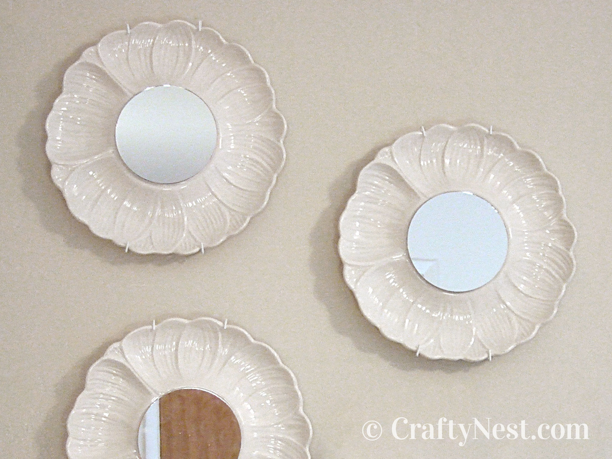 feature-thrift-store-plate-mirrors-crafty-nest Three artichoke plates with mirrors, photo