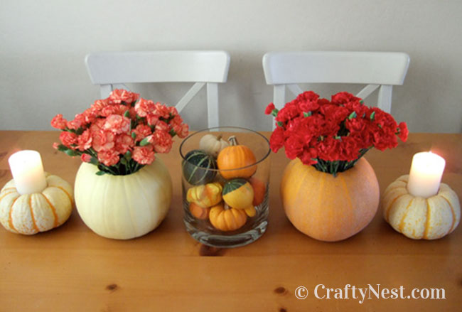 hero-fall-pumpkin-tabletop-ideas-crafty-nest Pumpkins made into vases and candle holders, photo