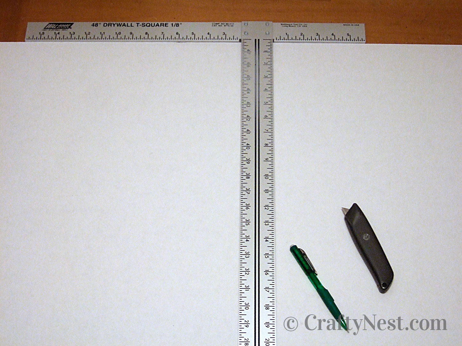 paper-drywall-ruler-crafty-nest Drywall T-square used to cut cardboard, photo