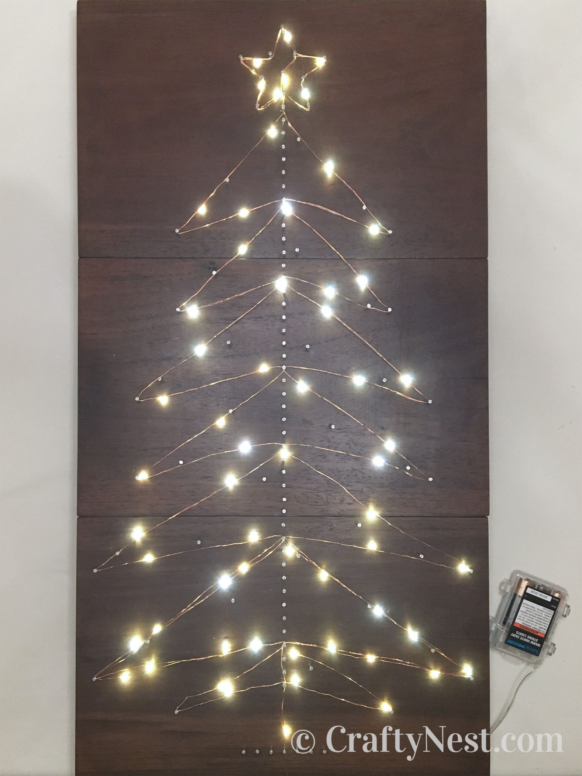 lights-advent-calendar-string-art-tree-with-lights-crafty-nest LED lights wound around the nails, photo