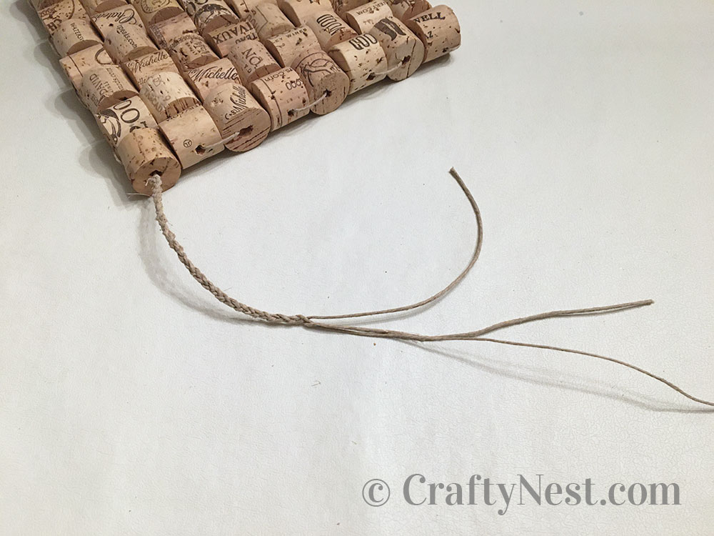 step13-woven-wine-cork-trivet-crafty-nest Braid the strings together, photo
