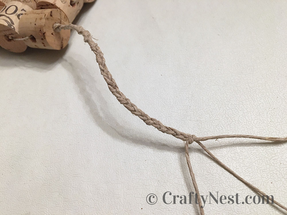 step14-woven-wine-cork-trivet-crafty-nest Tie knot at end of braid, photo