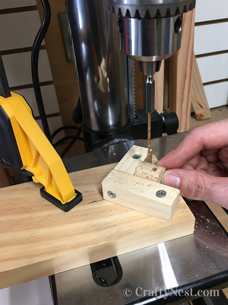 step3-woven-wine-cork-trivet-crafty-nest Drilling the corks with a drill press, photo