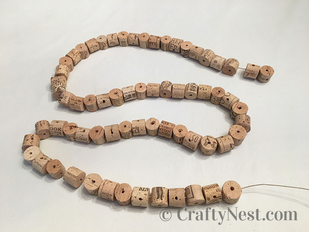 step8-woven-wine-cork-trivet-crafty-nest Corks strung on a string, photo